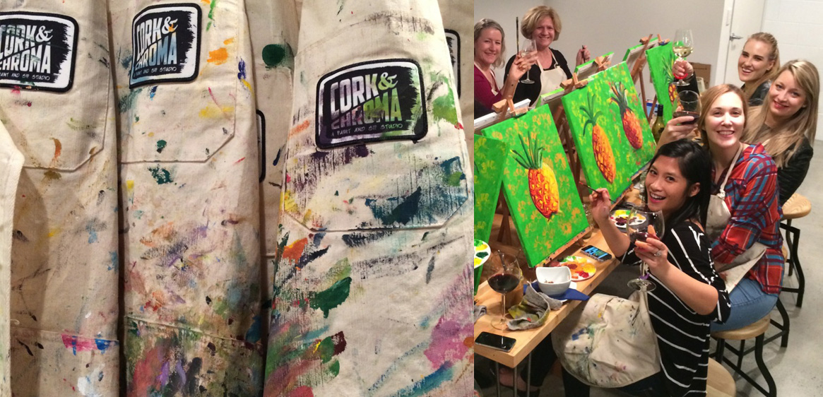 painting smocks covered in paint and a group of young women painting canvases while drinking wine