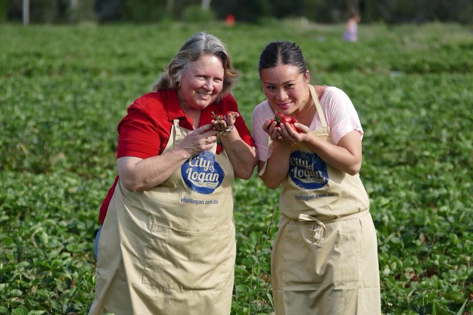 Strawberry Farms To Visit In Brisbane | two women holding strawberries