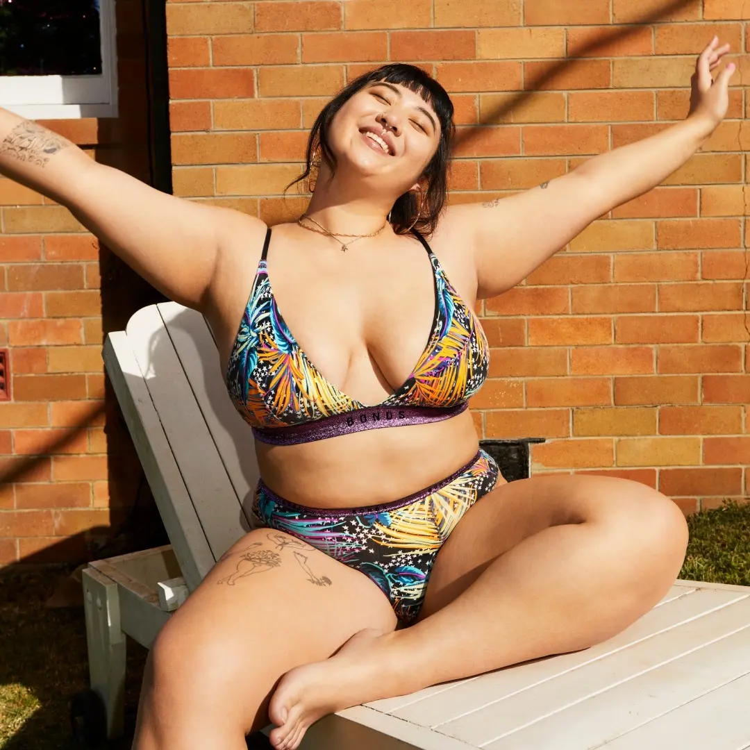 plus-sized model wearing firework printed bikini